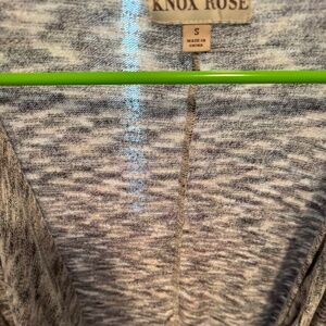 Sweater with flowing details